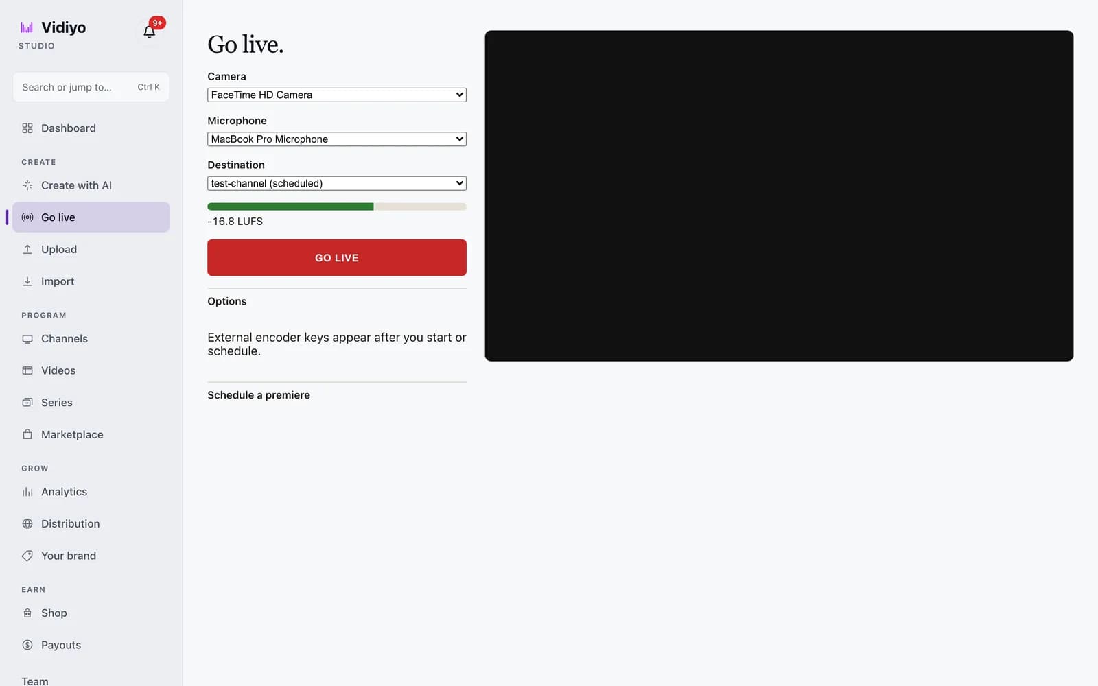 The Go live page in Vidiyo Studio: Camera, Microphone, and Destination dropdowns, a green loudness meter reading -16.8 LUFS, a red GO LIVE button, an Options row, the note External encoder keys appear after you start or schedule, a Schedule a premiere row, and a black camera preview on the right.